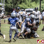 Tamuning Steelers Jaythan Trinidad powers his way through the Cowboys defense. (photo by Bout It Productions)