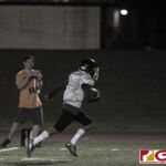 GSPN's Jay Leon Guerrero captures video of The JFK Islanders scoring a touchdown in the first half. (photo by Bout It Productions)