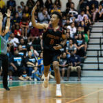 FD Friars Tony Quinene keeps the energy high in the UOG Calvo Field House after sinking in the three pointer. (Photo by Michael Blas)
