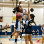 Guam High Panthers Taneeha Henderson powers through the defense and leaps for a layup. (Photo by Michael Blas)