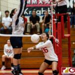 St. John's Knight Nikki Mathews bumps after a block from Harvest's Carissa McMillan. (Photo by Michael Blas)