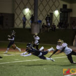 Guam High Panthers Ruben Ramirez attempts to intercept the ball from the Titans offense. (photo by Bout It Productions)