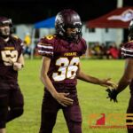 Father Duenas Friars Luke Reyes is congratulated after scoring a touchdown from an interception. (Photo by Michael Blas)