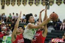 Islander Ryle Reyes meets heavy contest on his drive to the basket in the second half. (photo by Robert Balajadia)