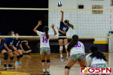 Okkodo Bulldog Jovie Jasmin connects with a spike to send the ball over the net. (Photo by Michael Blas)