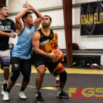 Phoenix Sons Dwayne Sablan looks for the basket as St. Pauls Drew Borja defends. (Photo by Michael Blas)