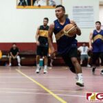 GW Geckos Lance Gogue maintains the pace of the game and brings the ball down court. (Photo by Michael Blas)