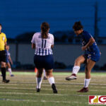 ND Royals Lauren Phillips shoots past a defender to score a goal in the first half. (Photo by Michael Blas)