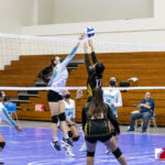 The Southern High Dolphin Tasi Naputi & Tiyan Titan Andreyana Sejalbo meet face to face over the net. Photo by Bout It Productions.
