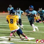 Southern Dolphin Lawrence Aflague (25) flattens out Panther Jayson Jackson (8) to clear the way for RB Conan Baza's run in for a touchdown. (Photo by Michael Blas)