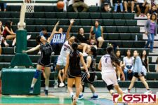 Okkodo Bulldog D'Shanae Cruz fires a floater over St. Paul Warrior Monica Giger. (Photo by Michael Blas)