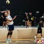 Harvest Eagles Jacob Oshiro serves to the home team Titans early in the third set of the game. (Photo by Michael Blas)