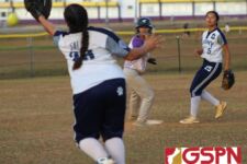 The infield watches on as the ball just gets past Cougars third basemen Olivia Salas. (photo by Robert Balajadia)