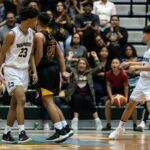 St. Paul Warriors Reo Aiken and FD Friars Christian Leon Guerrero stay heated in the final minutes of the game. (Photo by Michael Blas)