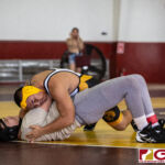 High School wrestlers hit the mats in a Preseason Tournament held at the FD Jungle. (photo by Bout It Productions.)