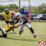The Cowboys Connie Toney stretches away from the Eagles Jeofry Limtiaco for extra yardage. (photo by Bout It Productions)