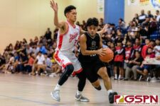 JFK Islander Amram Yobei attacks the basket against Okkodo Bulldog Jarwin Espiritu. (Photo by Michael Blas)
