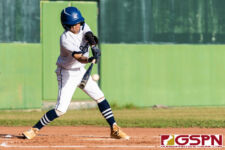 ND Royal Ethan Lobaton gets a hit on the ball in the first inning of the championship game. (Photo by Michael Blas)