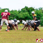 The Simon Sanchez Sharks run a couple of plays during practice in preparation for the 2019 IIAAG High School Football Season. (Photo by Michael Blas)