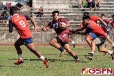 FD Friar Eugene Arriola breaks through a tackle in the first half of the game against the Okkodo Bulldogs. (Photo by Michael Blas)