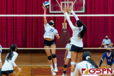 ND Royal Gia Camacho goes in for a kill against Academy Cougar Kristen Serrano. (Photo by Michael Blas)