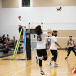 Okkodo Bulldog Raven Cardines sends the ball back to the Tiyan Titans. Photo by Bout It Productions.