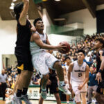 St. Paul Warriors Thelo Orichiro on the attack while FD Friars Kyle Camacho contests. (Photo by Michael Blas)
