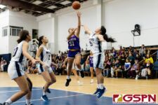 GW Gecko Amanda Uncangco releases a floater while St. Paul Warrior Kat Santos contests. (Photo by Michael Blas)