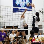 George Washing Geckos Evita Laguana looks for a kill while St. Paul Warriors Niah Siguenza attempts to block. (Photo by Michael Blas)