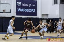 FD Friars Isaian Pelkey takes the dribble from behind while St. Paul Warriors Telo O. looks for the steal. (photo by Bout It Productions)
