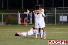 Harvest Eagles Taka Ward and Gye Baek Kim celebrate after their 1-0 victory over the JFK Islanders to become the 2019 IIAAG High School Boys Soccer Champions. (Photo by Michael Blas)