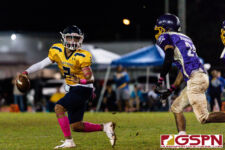 Guam High Panther Travon Jacobs evades GW Gecko Devin Benavente and throws for a completion. (Photo by Michael Blas)