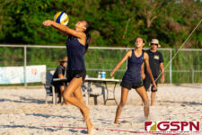 Academy Cougar Kristen Serrano chases the ball down to keep the volley going. (Photo by Michael Blas)
