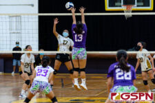 GW Gecko Bonita Castro lands a touch on Tiyan Titan Andreyana Sejalbo's spike. (Photo by Michael Blas)
