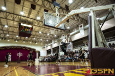 FD Friars Brock Ada shoots over Jfk Islanders Ralf Manalac. in front of ( photo by Bout It Productions )