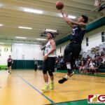 St. Paul Warriors Reo Aiken gets a shot off as he gets shoved out of bounds. (Photo by Michael Blas)