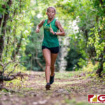 JFK Islander Mya Tolerson exiting the jungle trail in first place for the girls. (Photo by Michael Blas)