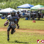 Guam Raiders Ethan Guerrero runs toward the sidelines for positive yardage. (photo by Bout It Productions)