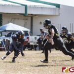 Island Stunnerz Melanie Manglona receives the ball while the Steel Blazing Saints comes lurking in. (photo by Bout It Productions)