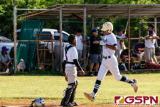 ND Royal Ethan Lizama gets brought in for a score in the first inning of the game. (Photo by Michael Blas)