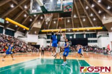 FD Friar Daryl Robles floats the ball over St. Paul Warrior Audrey Dela Cruz. (Photo by Michael Blas)