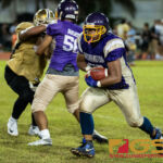 George Washington Geckos Jose San Miguel drives the ball forward to gain a first down. (Photo by Michael Blas)