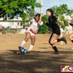 St. John's Knights Hallie Wigsten clears the ball off of Warriors attacker Janniliese Quintanilla. (Photo by Michael Blas)