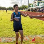 St. Paul Warriors Brandon Miranda crosses the finish line in first place with a time of 17:54.84. (Photo by Michael Blas)