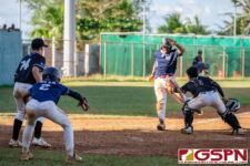 Guam's Nolan Babauta makes it home before getting tagged by New Zealand's Luke Devine. (Photo by Michael Blas)
