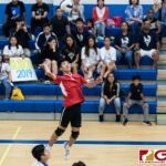 St. John's Knights Warren Chen loads up for the spike late in the first set. (Photo by Michael Blas)