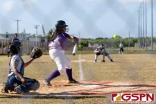 GW Gecko Andrea Ninete takes a swing at the ball in the first inning of the game. (Photo by Michael Blas)