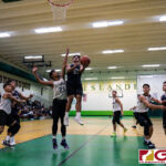 St. Paul Warriors Telo Orichiro flies high for a layup while JFK Islanders Lawrence Tisalona gets a hand up to block. (Photo by Michael Blas)