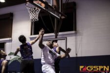 Southern High Dolphins E. Quintanilla glances up as his shot gets through the net. ( photo by Bout It Productions )