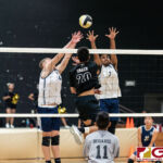 Tiyan Titans Jericho Snaer hits a spike past the Eagles Chase Kieth and Alan Thomas. (Photo by Michael Blas)